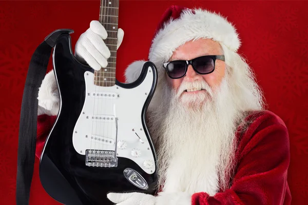 Father Christmas shows guitar — Stock Photo, Image