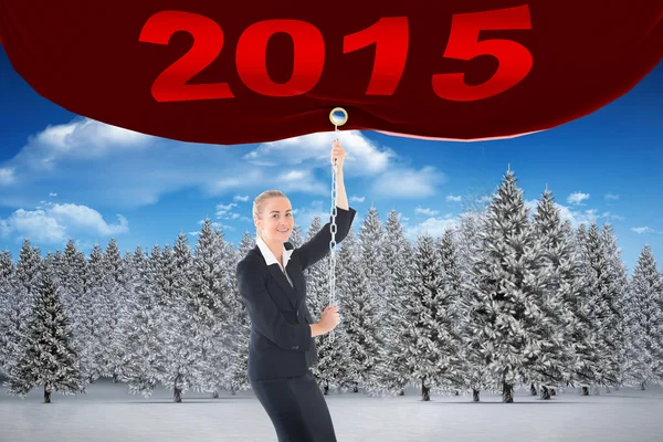 Businesswoman pulling a chain — Stock Photo, Image