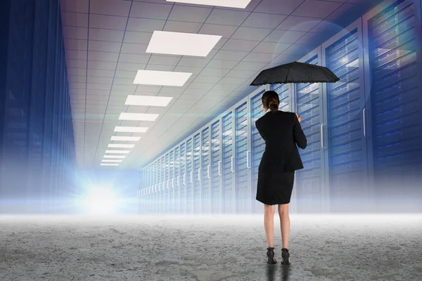 Businesswoman holding umbrella — Stock Photo, Image