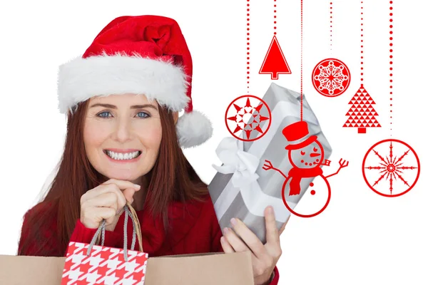 Composite image of woman with gifts — Stock Photo, Image