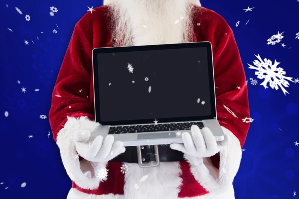 Santa Claus prezentuje laptopa — Zdjęcie stockowe