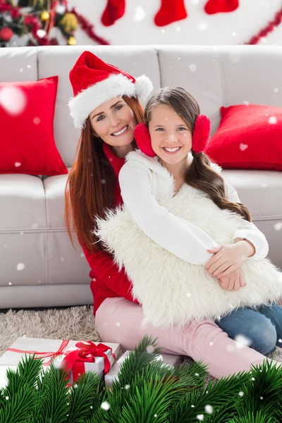 Festive mother and daughter smiling — Stock Photo, Image