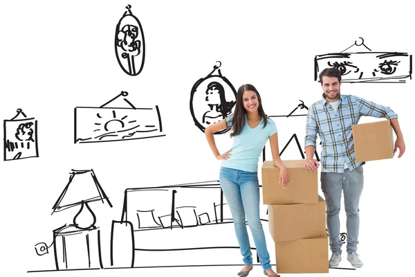 Young couple with moving boxes — Stock Photo, Image