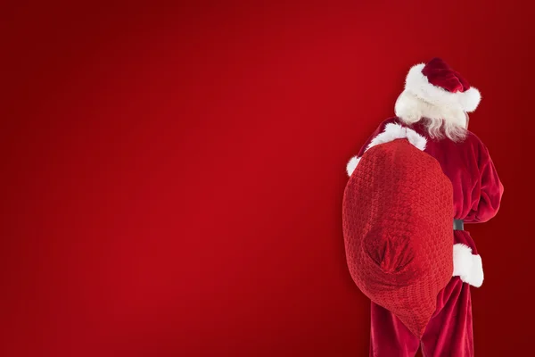 Papai Noel está segurando sua bolsa — Fotografia de Stock