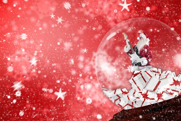 Santa rocking out in snow globe — Stock Photo, Image