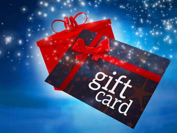 Flying gift card and present — Stock Photo, Image