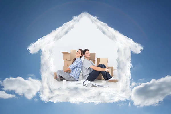 Composite image of couple sitting back-to-back — Stock Photo, Image