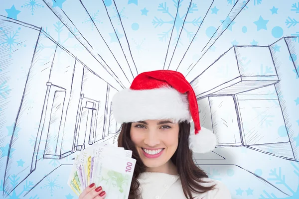 Happy brunette holding her cash — Stock Photo, Image