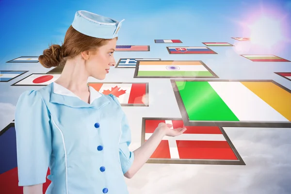 Air hostess presenting with hand — Stock Photo, Image