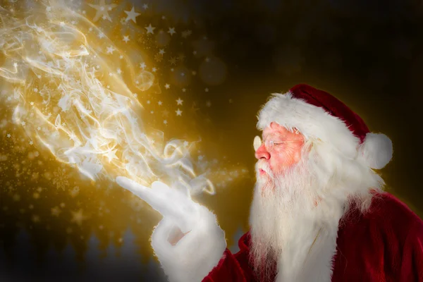 Santa claus blowing — Stock Photo, Image