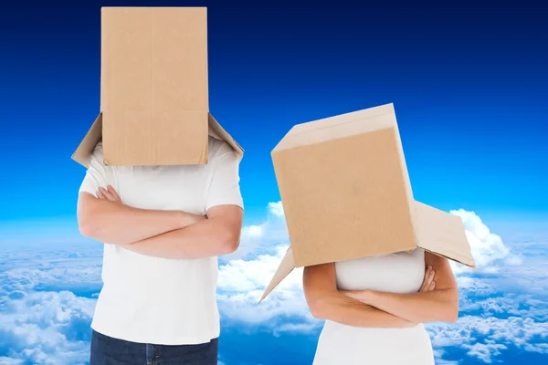 Mature couple wearing boxes over their heads — Stock Photo, Image