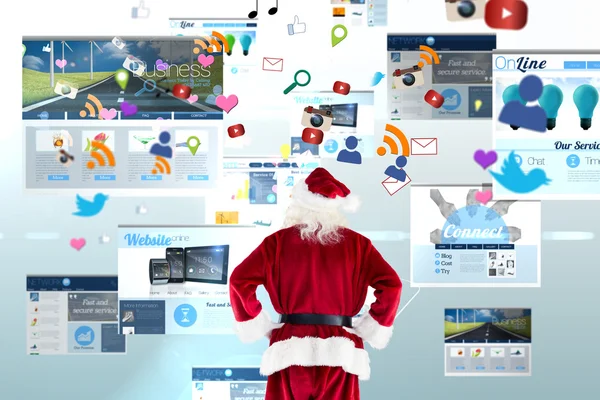 Santa Claus against screen collage — Stock Photo, Image