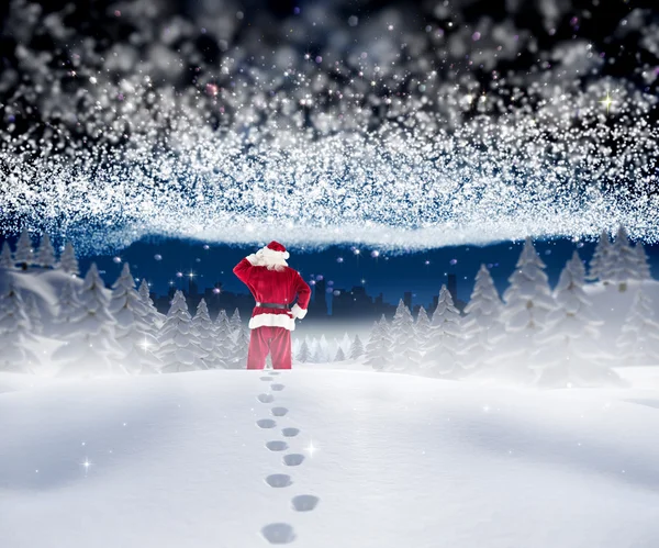 Santa procházky ve sněhu — Stock fotografie