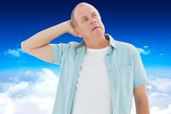 Thoughtful older man looking up — Stock Photo, Image