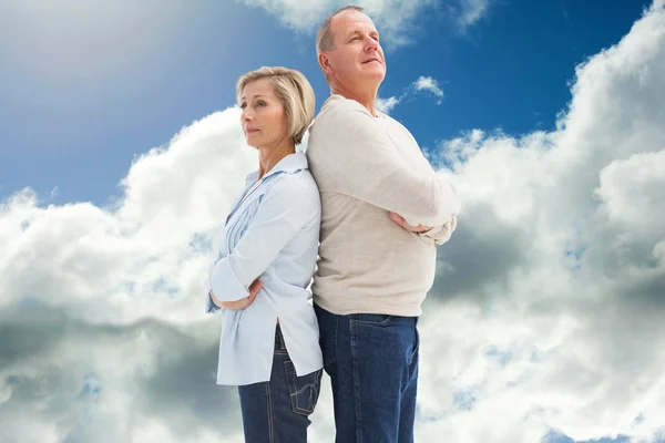 Mature couple standing and thinking — Stock Photo, Image