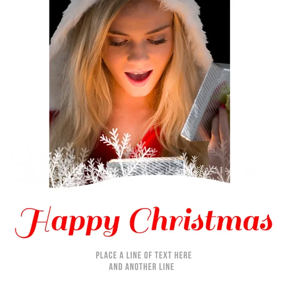 Pretty blonde in santa outfit opening gift — Stock Photo, Image