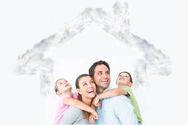 Happy young family looking up together — Stock Photo, Image
