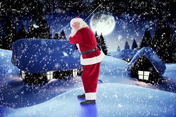 Santa Claus swings his golf club — Stock Photo, Image