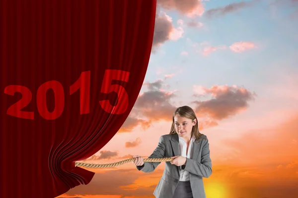 Businesswoman pulling a rope — Stock Photo, Image