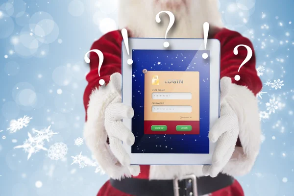 Composite image of santa presents a tablet pc — Stock Photo, Image