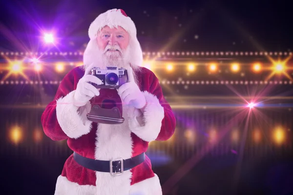 Weihnachtsmann macht Foto — Stockfoto