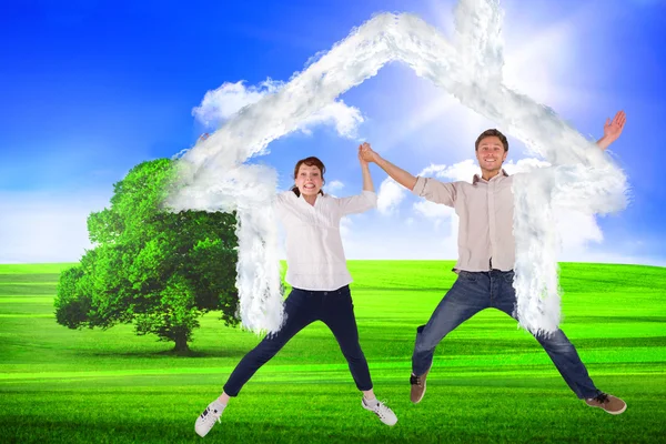Couple jumping and holding hands — Stock Photo, Image