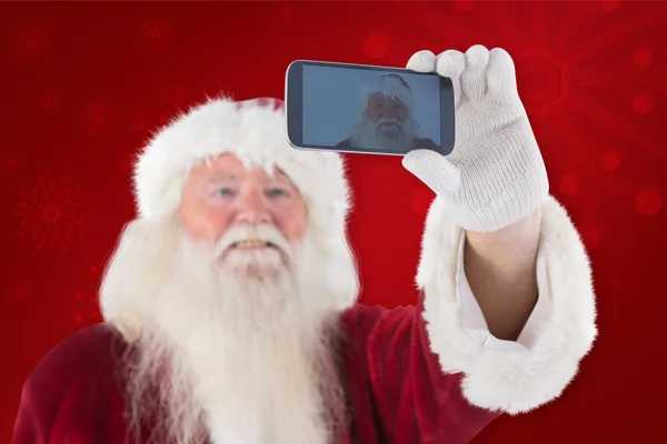 Santa taking selfie on phone — Stock Photo, Image