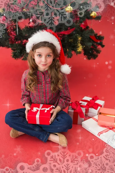 Festive little girl holding gift — Stock Photo, Image