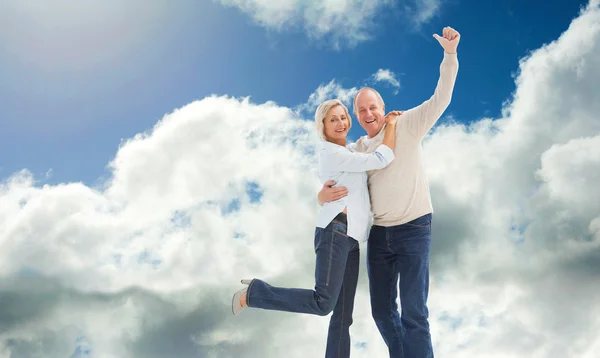 Happy mature couple cheering — Stock Photo, Image