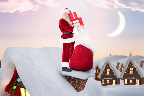圣诞老人在小屋的屋顶上 — 图库照片