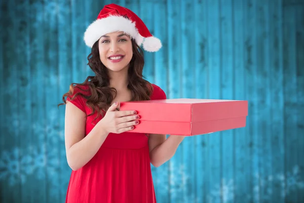 Композитное изображение праздничной брюнетки с красной коробкой — стоковое фото