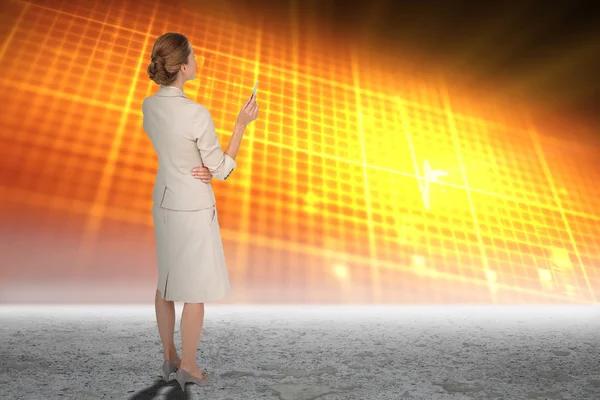 Thinking businesswoman against glowing grid — Stock Photo, Image