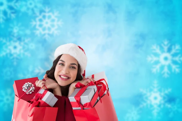 Excited brunette holding shopping bags — Stock Photo, Image