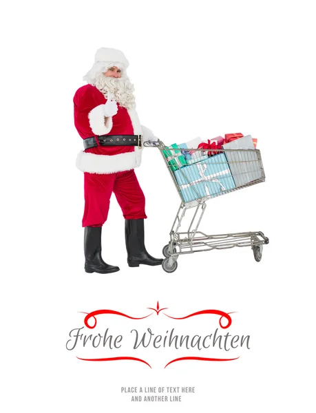 Positiver Weihnachtsmann, der Geschenke verteilt — Stockfoto