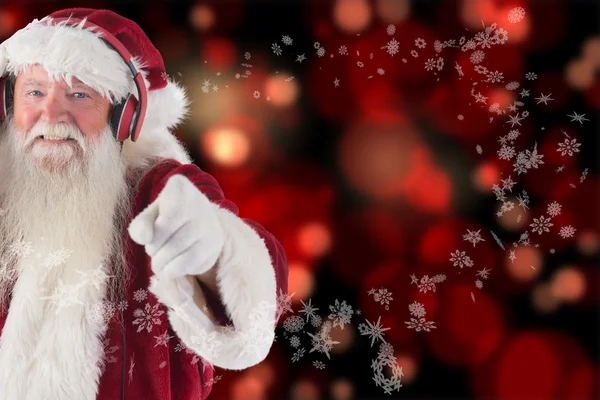 Santa is listening some music — Stock Photo, Image