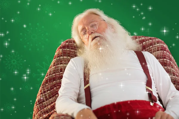 Father christmas sleeps on the armchair — Stock Photo, Image