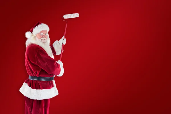 Babbo Natale dipinge muro — Foto Stock