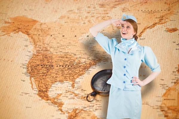 Pretty air hostess looking up — Stock Photo, Image