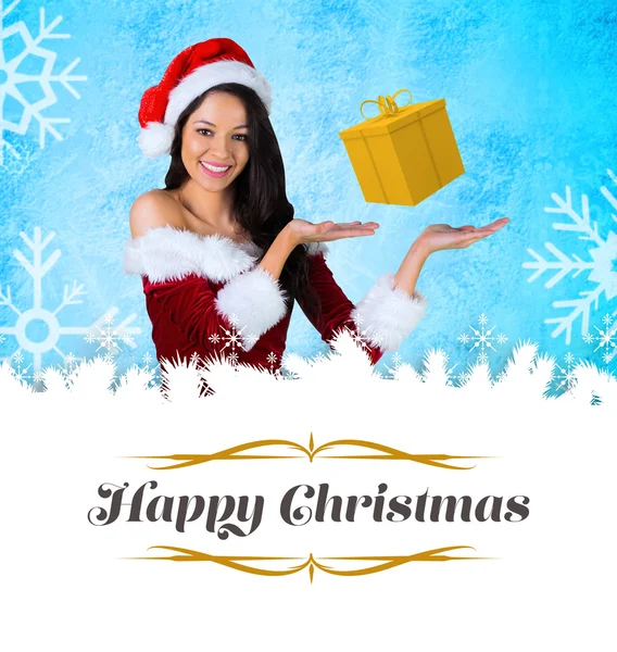 Pretty girl presenting in santa outfit — Stockfoto