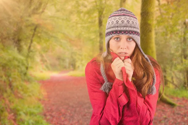 Cold redhead wearing coat and hat — Stock Photo, Image