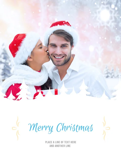 Composite image of festive young couple holding gift — Stock Photo, Image