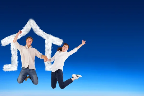 Couple jumping and holding hands — Stock Photo, Image