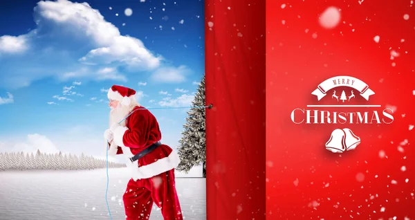 Santa claus touw trekken — Stockfoto