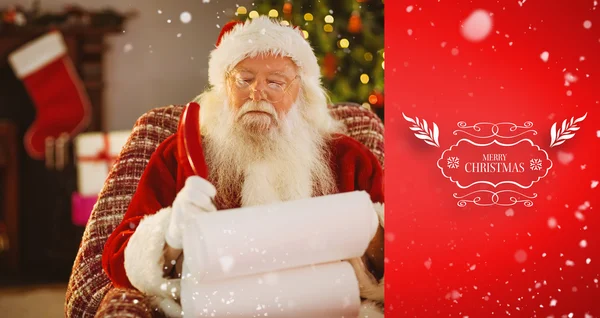 Santa claus writing his list with a quill — Stock Photo, Image