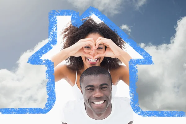 Attractive couple in matching clothes smiling — Stock Photo, Image