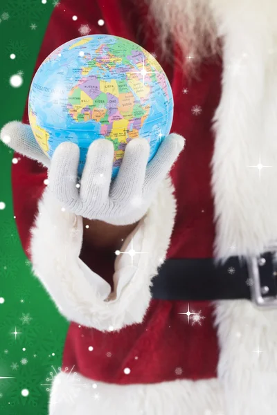 Santa has globe in hand — Stock Photo, Image