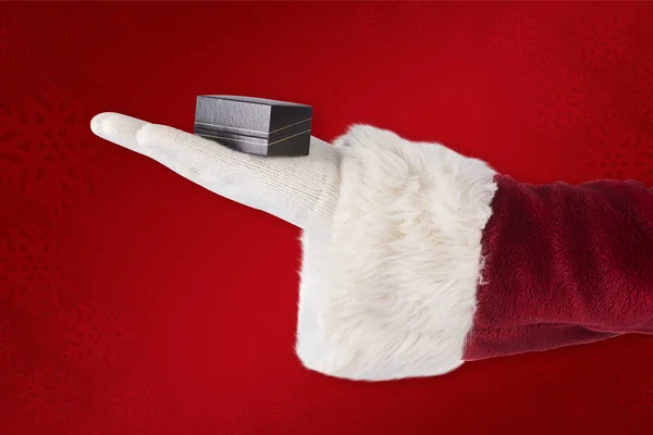 Santas hand toont kleine vak — Stockfoto