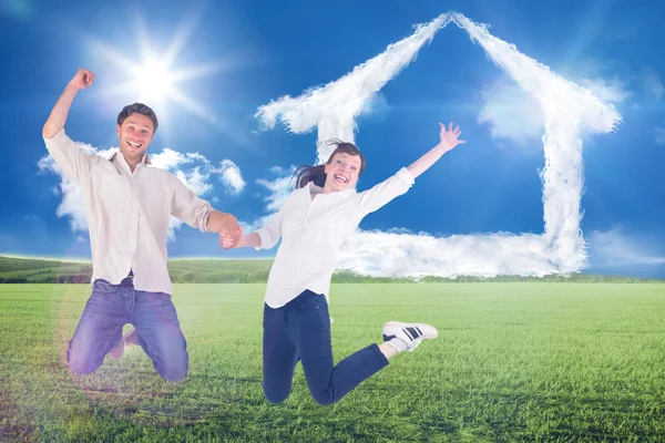 Couple jumping and holding hands — Stock Photo, Image