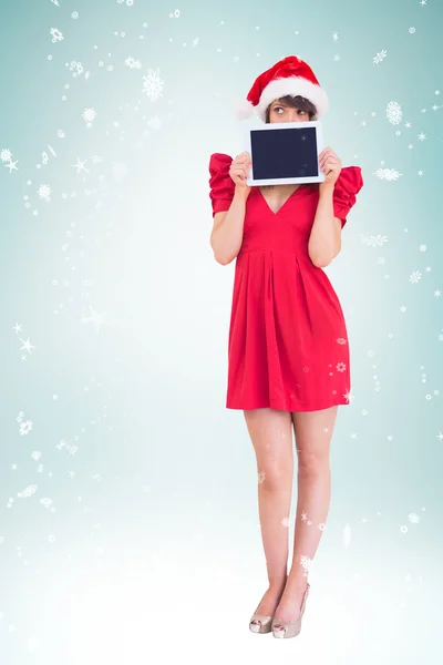 Feestelijke brunette houdt van een tablet pc — Stockfoto