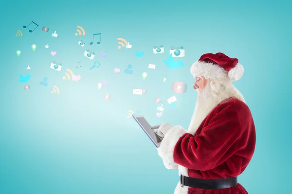 Santa uses a tablet PC — Stock Photo, Image